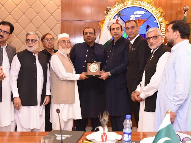 Mr. Atif Ikram Sheikh President FPCCI gives the shield to Mr. Atta Ur Rehman Yousafzai SV Chairman HIA